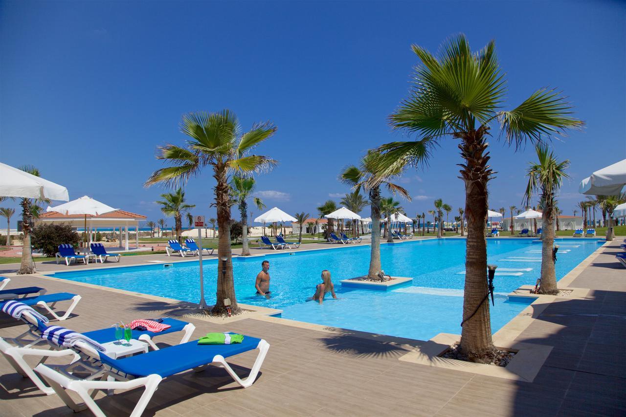 Rixos Alamein - Full Board Plus El Alamein Kültér fotó A swimming pool in a hotel