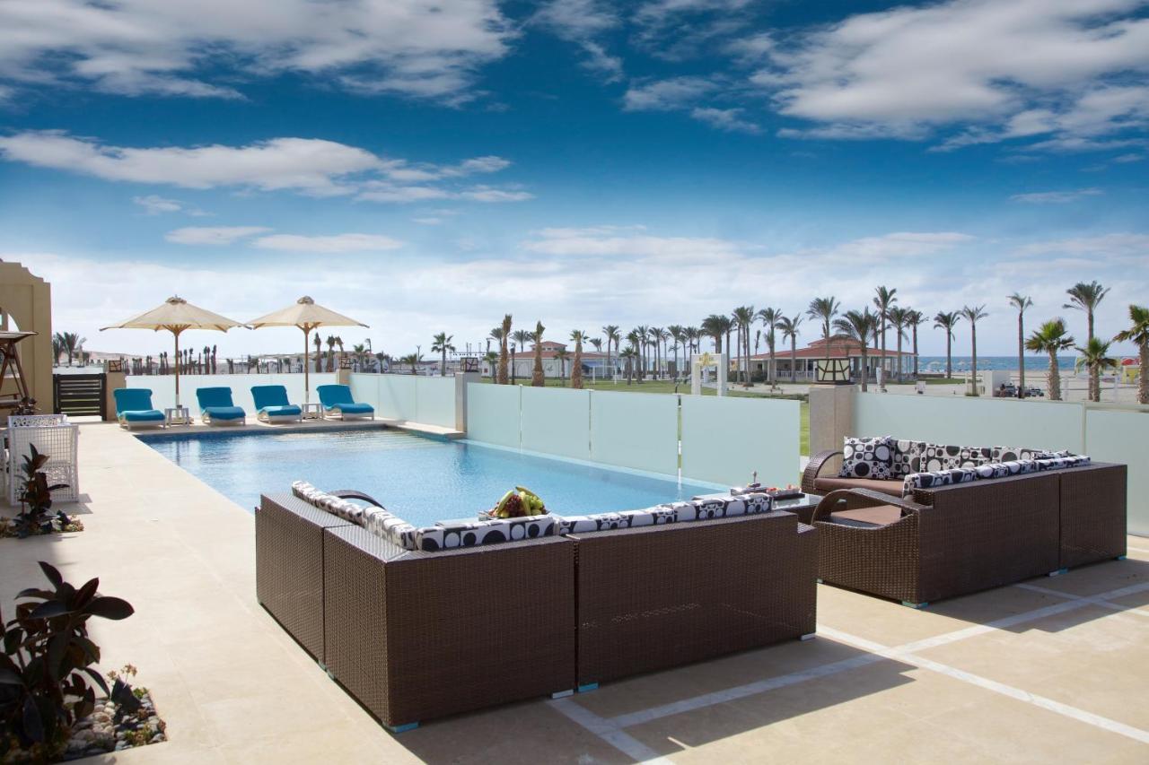 Rixos Alamein - Full Board Plus El Alamein Kültér fotó The pool at the Hilton Sharm El Sheikh