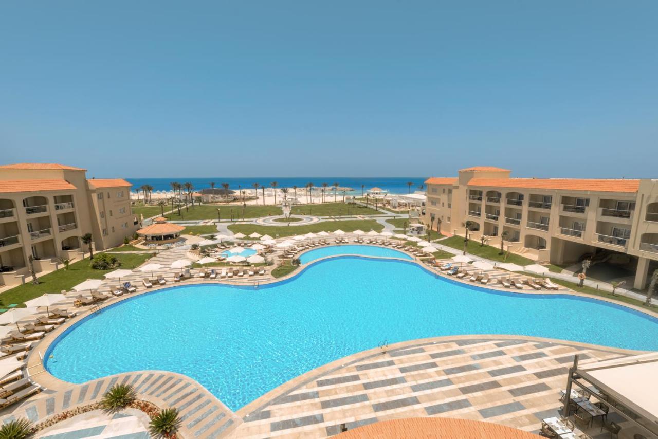 Rixos Alamein - Full Board Plus El Alamein Kültér fotó A pool at a resort in Egypt